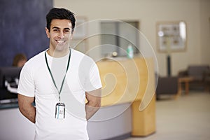 Portrait Of Male Physiotherapist In Hospital Reception