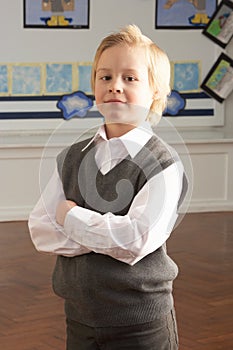 Portrait Of Male Primary School Pupil Standing In