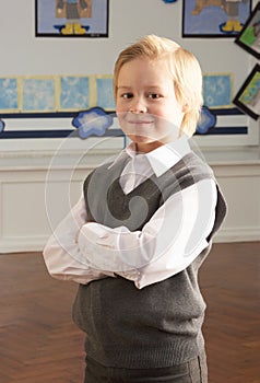 Portrait Of Male Primary School Pupil Standing In
