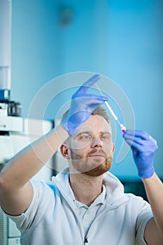 Portrait of a male researcher carrying out scientific research