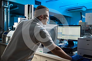 Portrait of a male researcher carrying out scientific research