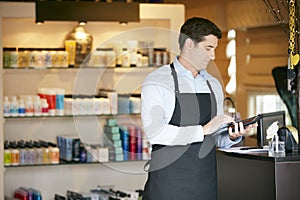 Portrait Of Male Sales Assistant In Beauty Product Shop