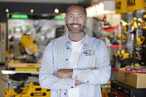 portrait male sales assistant in hardware store