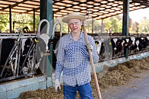 Portrait of a male standing on a livestock farm