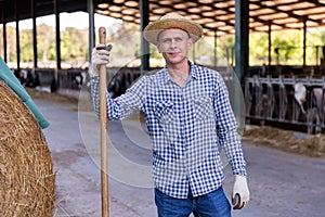 Portrait of a male standing on a livestock farm