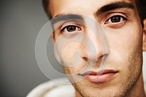 Portrait, male student and fashion with closeup in studio for cool, trendy or mockup for vision on gray background