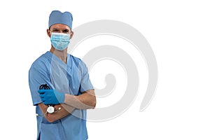 Portrait of male surgeon holding stethoscope against white background