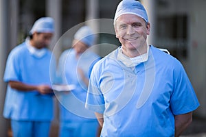Portrait of male surgeon smiling at camera photo