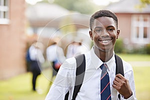 Portrait Of Male Teenage Student In Uniform Outside Buildings