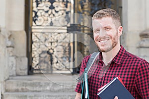 Portrait Of Male University Student Standing Outside Building