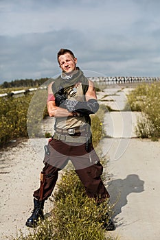 Portrait of a male vandal in dirty clothes