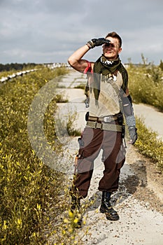 Portrait of a male vandal in dirty clothes