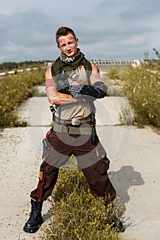 Portrait of a male vandal in dirty clothes