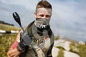 Portrait of a male vandal in dirty clothes