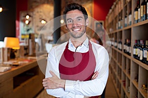 portrait male vendor in distillery shop photo