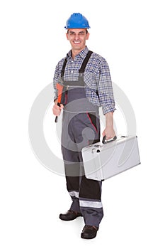 Portrait of a male worker holding worktool