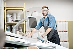 Portrait of a male worker at the printing manufacturing