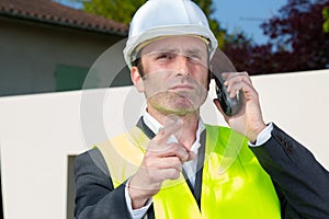 portrait male worker using walkie-talkie photo