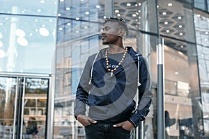 Portrait man African American attractive profile in the street. Fashion african man wearing jeans jacket poses on city