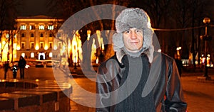 Portrait of a man against the backdrop of an evening city