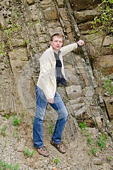 Portrait of a man against rocks