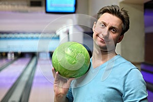 Portrait of man with ball for bowling