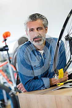 portrait man in bicycle shop