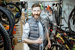 Portrait of a man with bicycles indoors