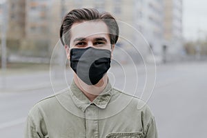 Portrait of a man in a black medical mask. Coronavirus