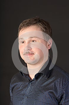 Portrait of a man in a blue shirt