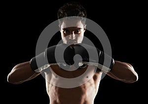 Portrait, man and boxer in stance for training, sports or workout for body health isolated on black background in studio