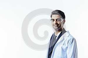 Portrait of a man in business suit, lab coat and protective glasses.