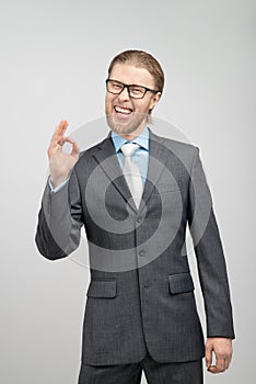 Portrait man businessman showing gesture OK