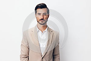 portrait man businessman smiling happy beige copyspace business suit handsome crossed