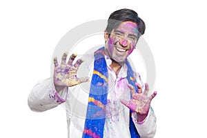 Portrait of a man celebrating Holi