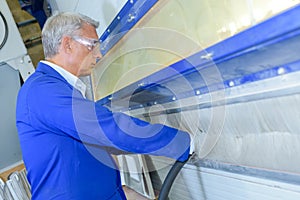 portrait man cleaning machine