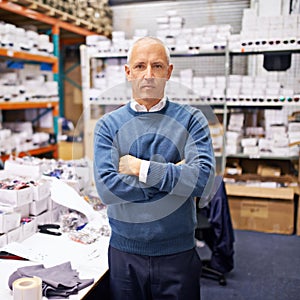 Portrait, man and confident by shelves in distribution warehouse and pride in career as inspection of stock. Mature face