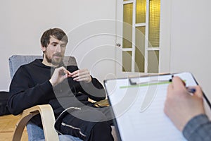 Portrait of a man at a consultation with a psychotherapist, talks about his problems. Mental health