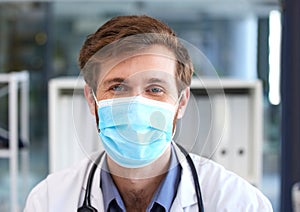 Portrait, man and doctor with covid face mask in hospital for medical safety, healthcare risk and clinic analysis in