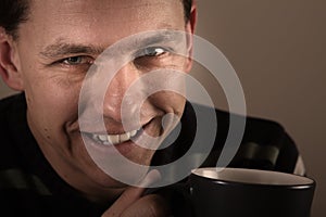 Portrait of man drinking hot beverage