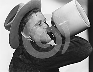 Portrait of man drinking from jug photo