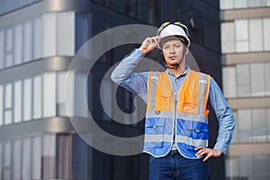 portrait man engineer standing working standing at rooftop building construction. Male technician worker working checking hvac of