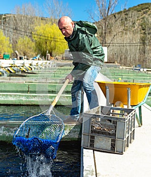 Portrait of man fish farm worker