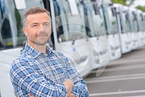 Portrait man with fleet buses