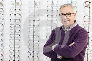 Portrait of man in frame glasses shop