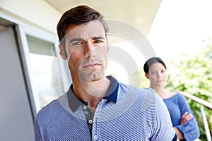 Portrait, man and frustrated in outdoor for relationship conflict with stress, fight and tension. Sad face, person and