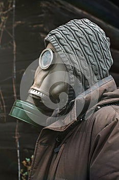 Portrait of a man in a gas mask. Panic during quarantine. Coronavirus pandemia concept. Stalker in a gas mask, Chernobyl Exclusion