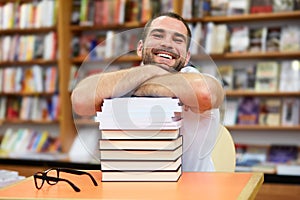 Portrait of a man with glasses in a bookstore