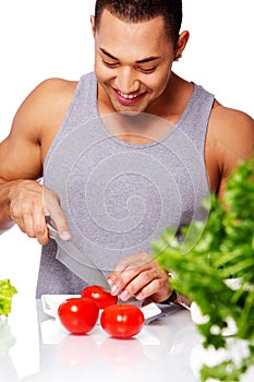 Portrait of man in grey shirt going to eat tomato