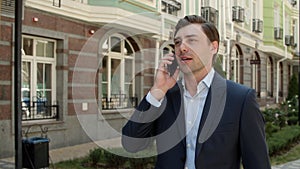 Portrait man having mobile conversation. Man talking phone about business